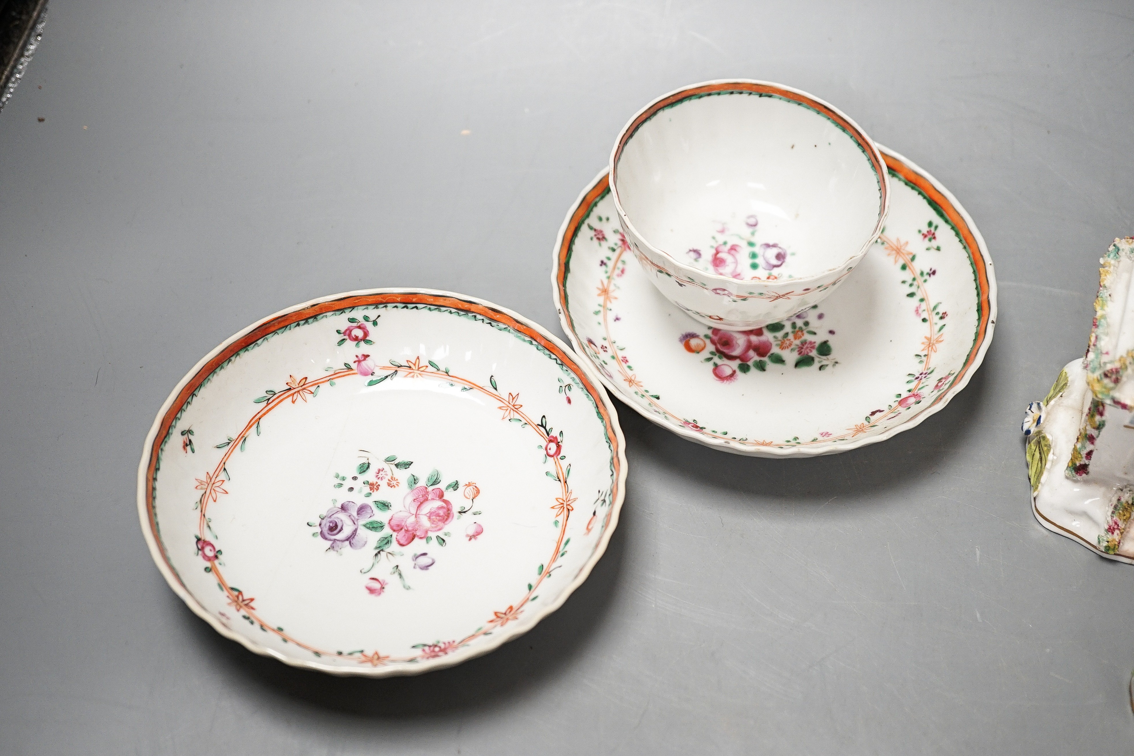 Three Chinese export famille rose tea bowls and two saucers, three Staffordshire porcelain cottage pastille burners and an English porcelain cream boat